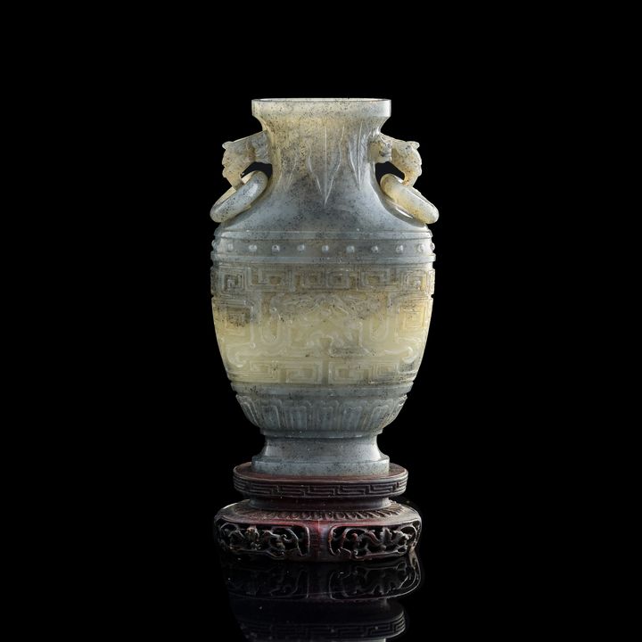 十九世紀早 玉雕饕餮紋瓶(附原配硬木座) A Chinese carved jade vase, early 19th century