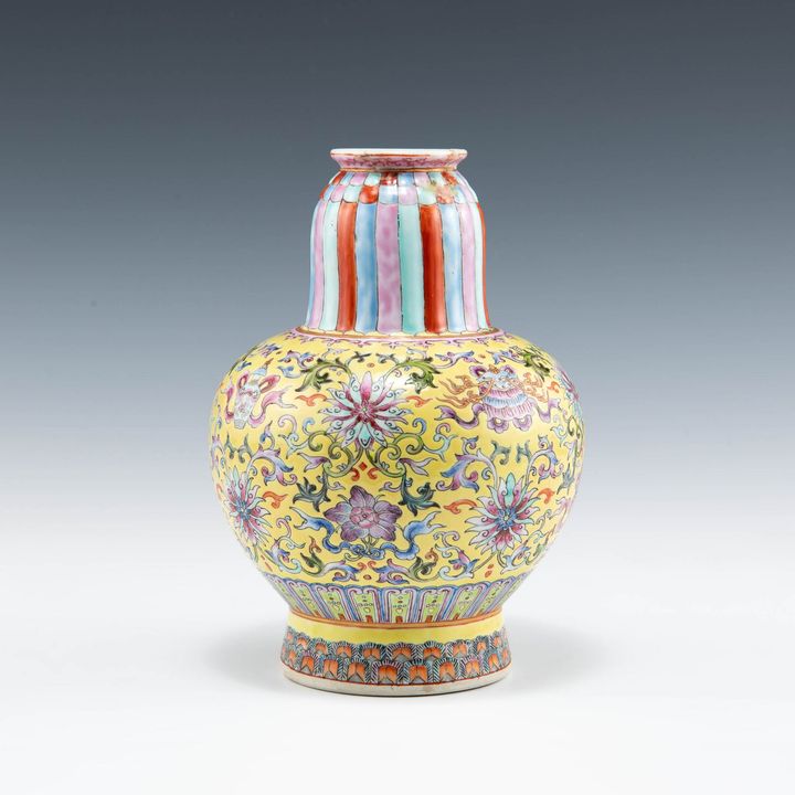 民國 黃地粉彩纏枝八寶賁巴瓶 A Chinese yellow-ground famille rose benba vase, Republic period