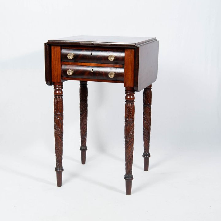 A Classical figured mahogany and mahogany veneer drop-leaf work table