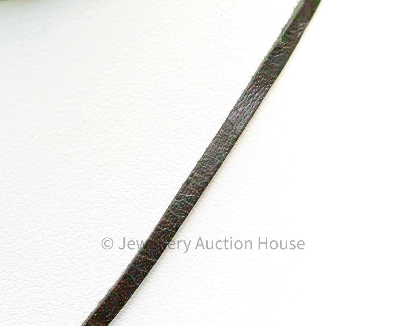 PEARL CROSS ON LEATHER CORD Jewellery Auction House