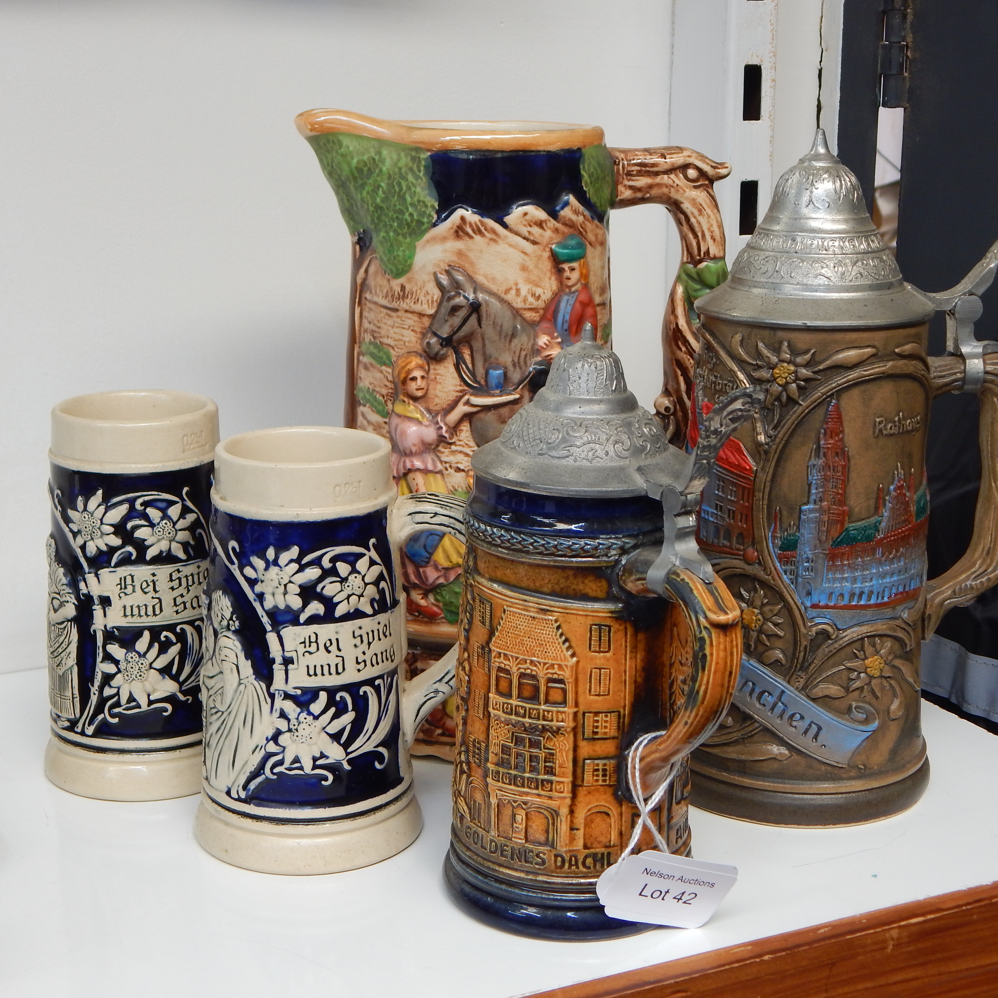 4 German + musical Japanese Steins — sold at auction in New Zealand for $10