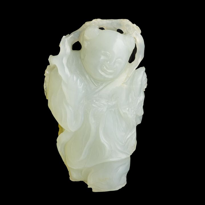 十八世紀 白玉童子掛墜 A Chinese carved white jade 'boy' figure, 18th century