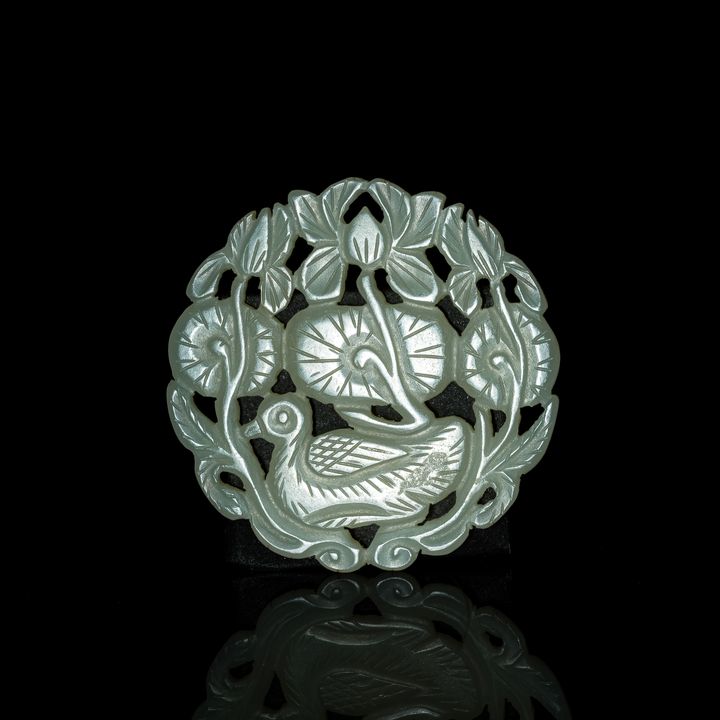 明代 白玉鏤雕荷花鴨子圓佩 A Chinese carved white jade 'lotus' and 'duck' pendant, Ming dynasty