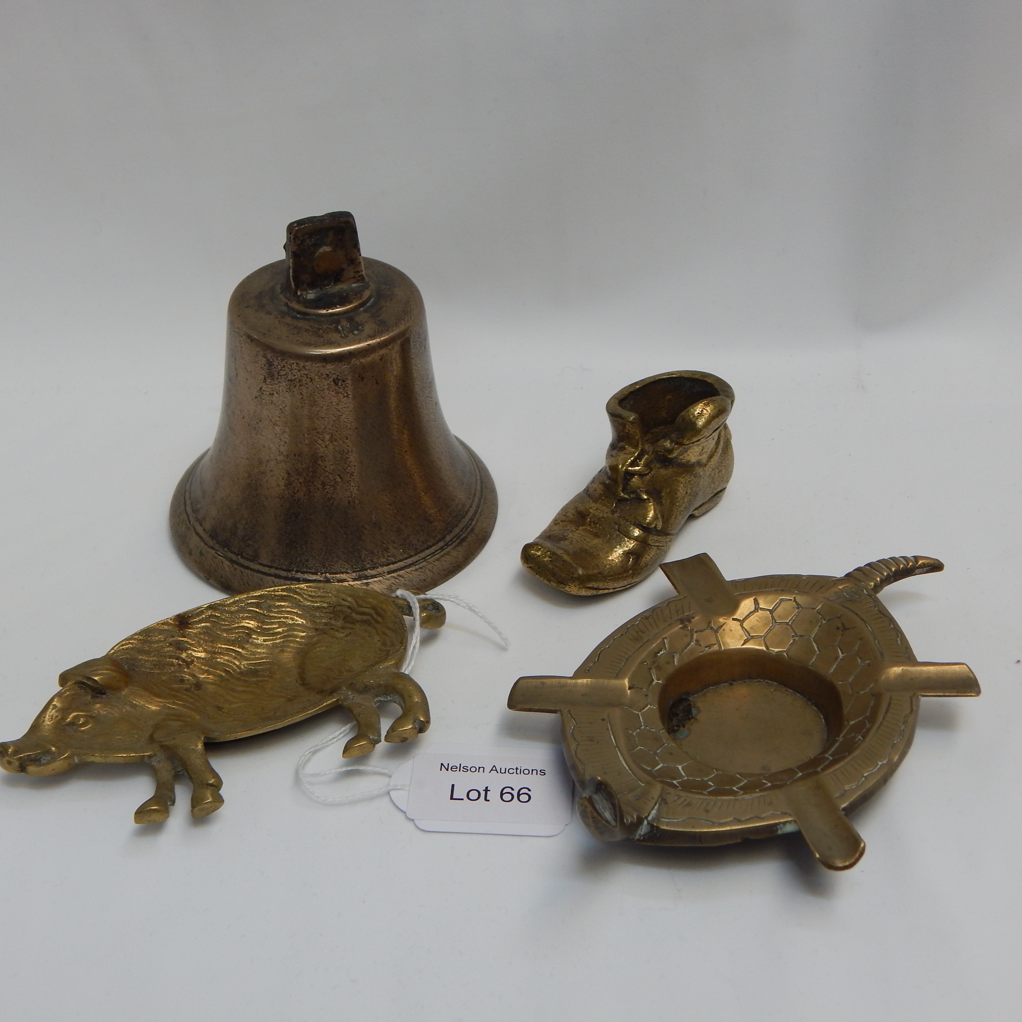 4 Brass items - shoe + pig + bell + turtle ash tray — sold at auction in New Zealand for $20