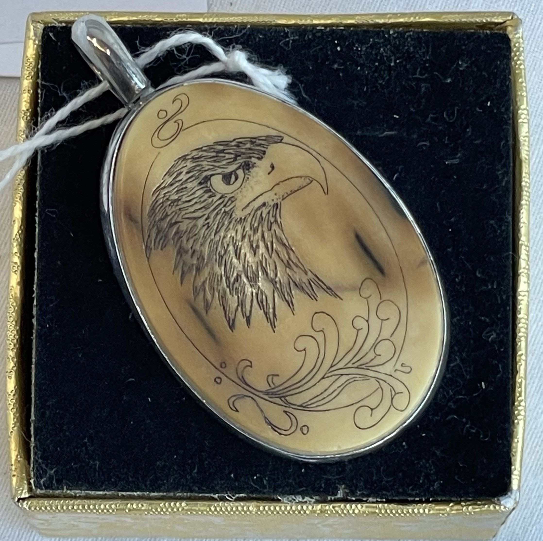 Scrimshaw Style Pendent w St Silver surround — NZ auction result