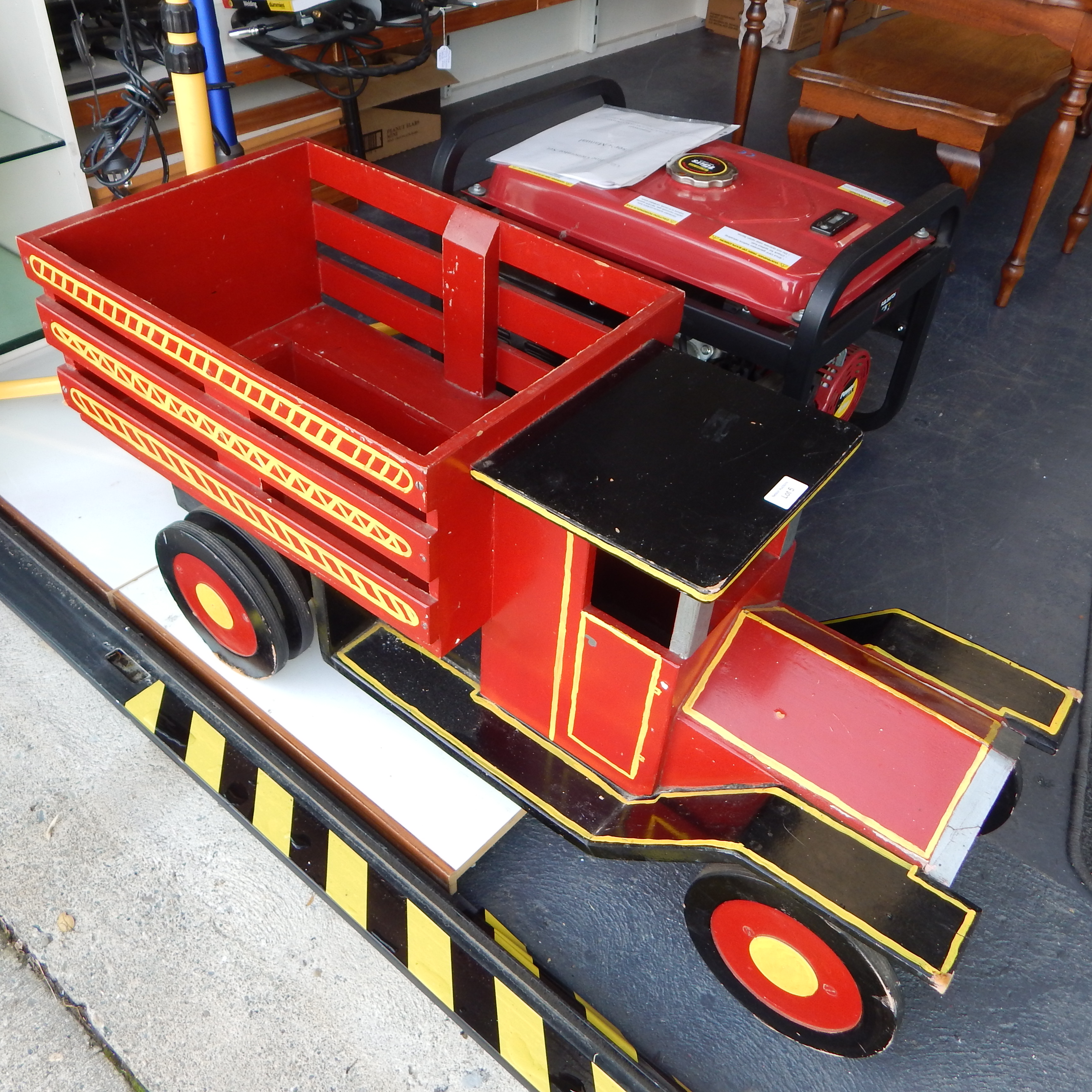 Red wooden truck - castor wheels — sold at auction in New Zealand for $50