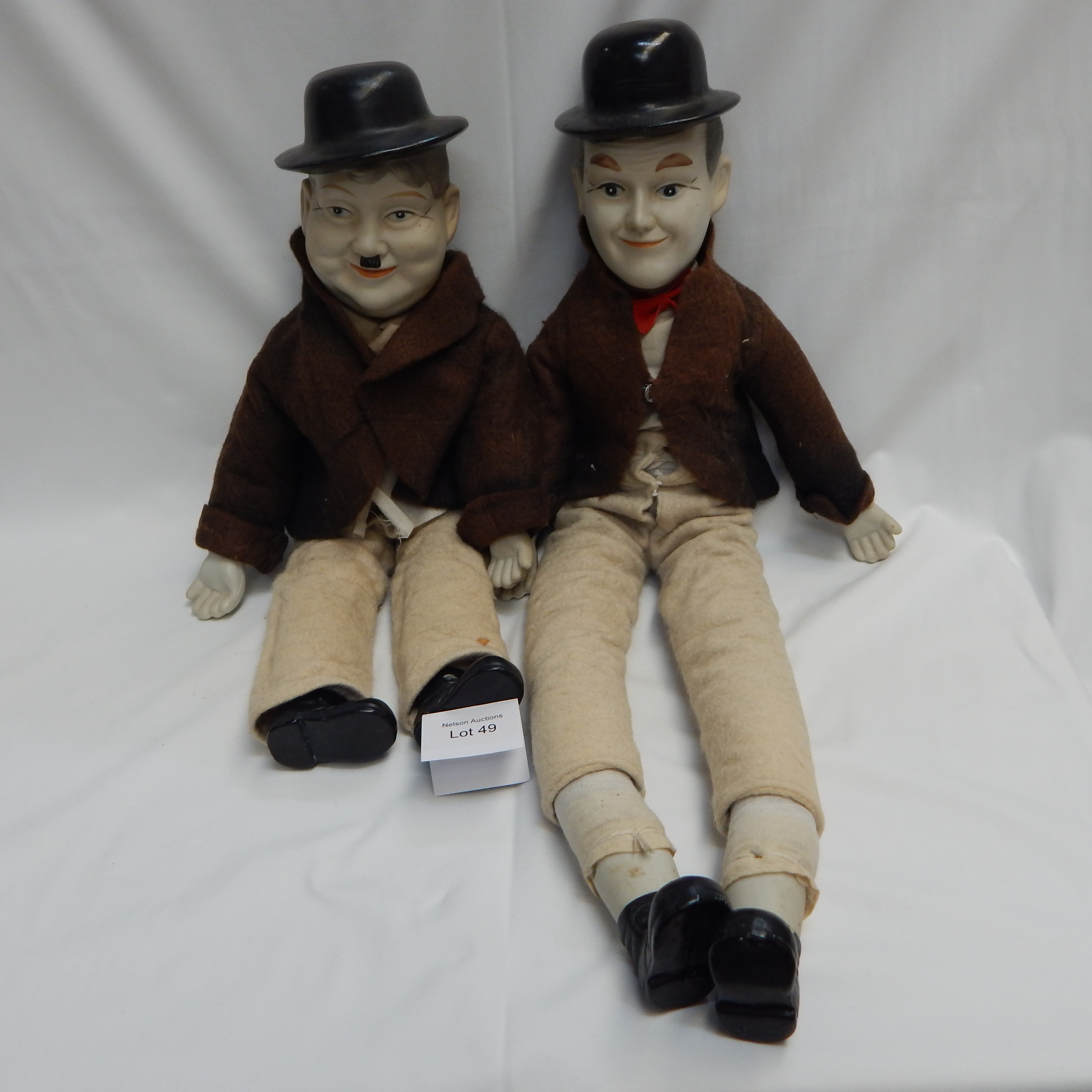 2 Porcelain Laurel + Hardy Dolls — sold at auction in New Zealand for $40