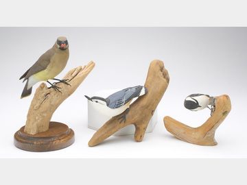 Three decorative songbirds, Randy and Elaine Fisher and Michael Van Houzen.