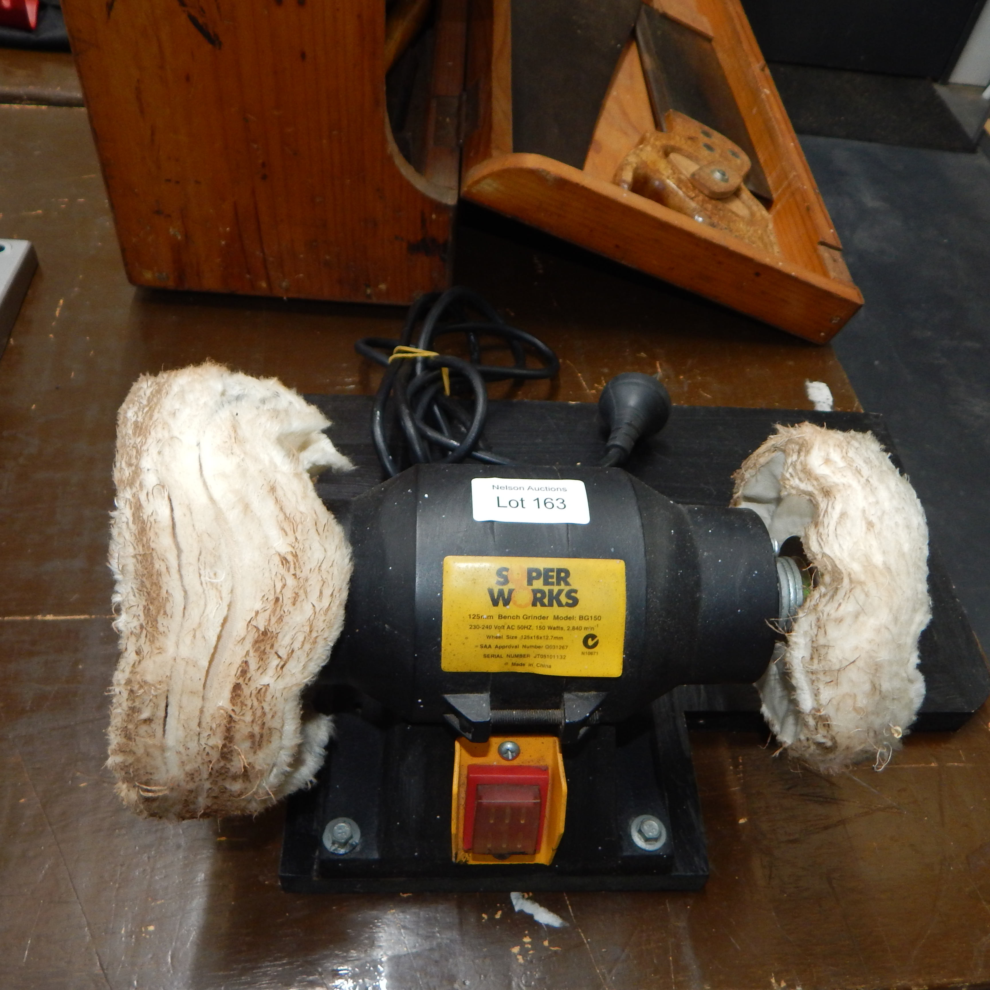 Superworks bench grinder w buffing wheels — sold at auction in New Zealand for $20