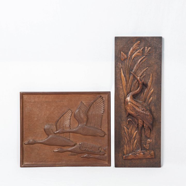 Two carved wooden plaques