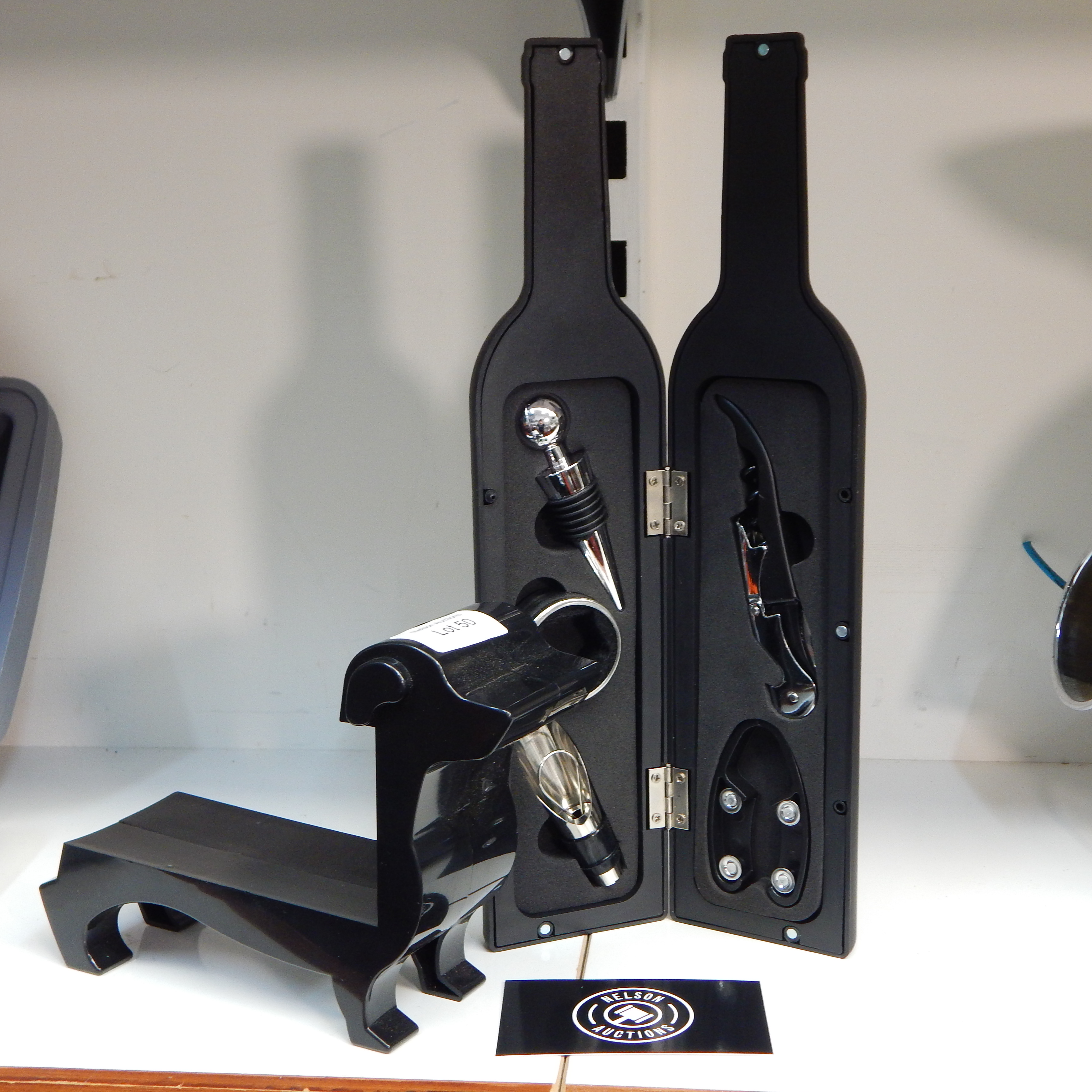 Waiters Friend - black bottle shaped case + dog stand — sold at auction in New Zealand for $10