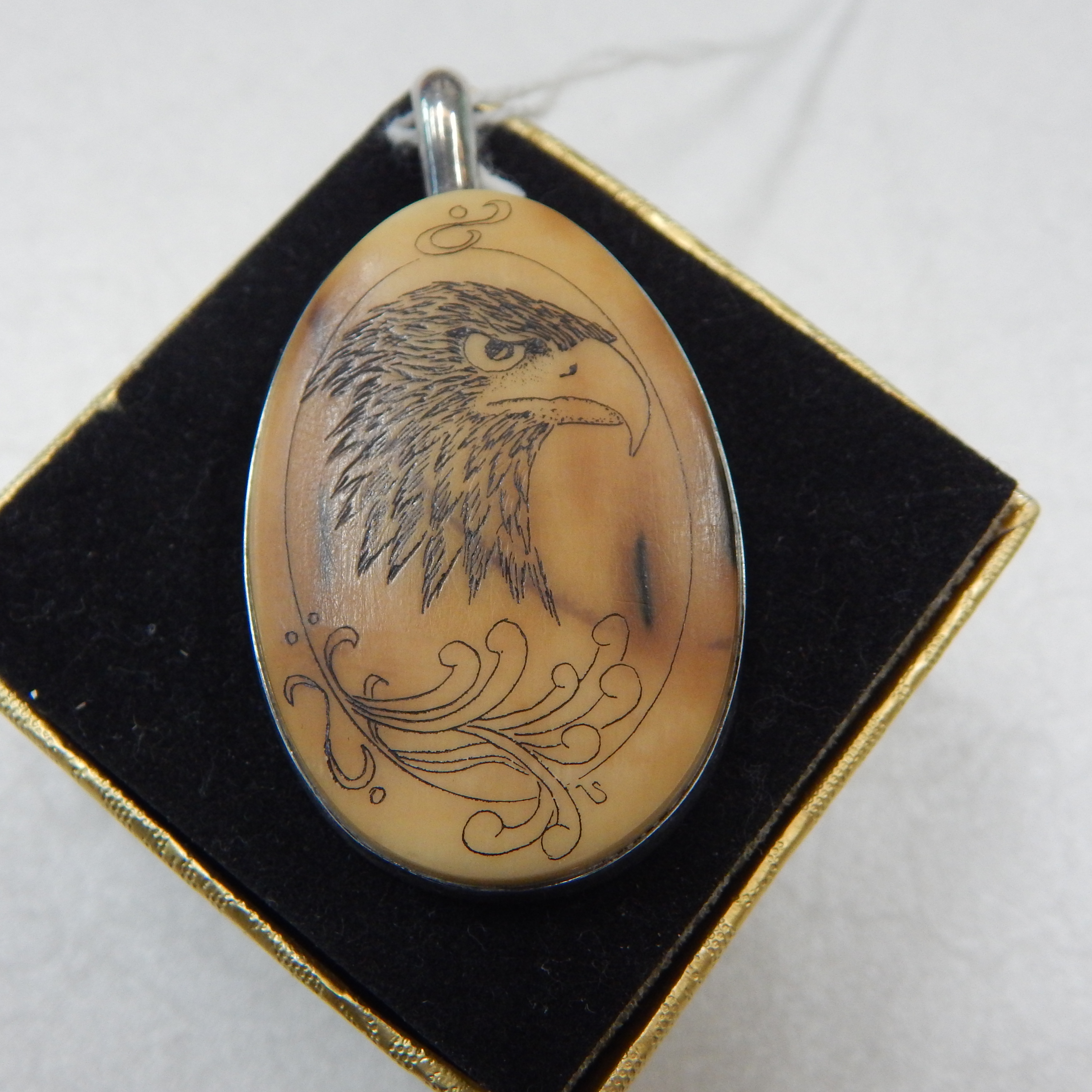 Pendant w Scrimshaw-style Eagle w St/Silver surround — sold at auction in New Zealand for $40