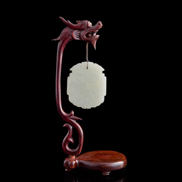十九世紀早 白玉節慶有餘牌(附木架) A Chinese white jade plaque, early 19th century
