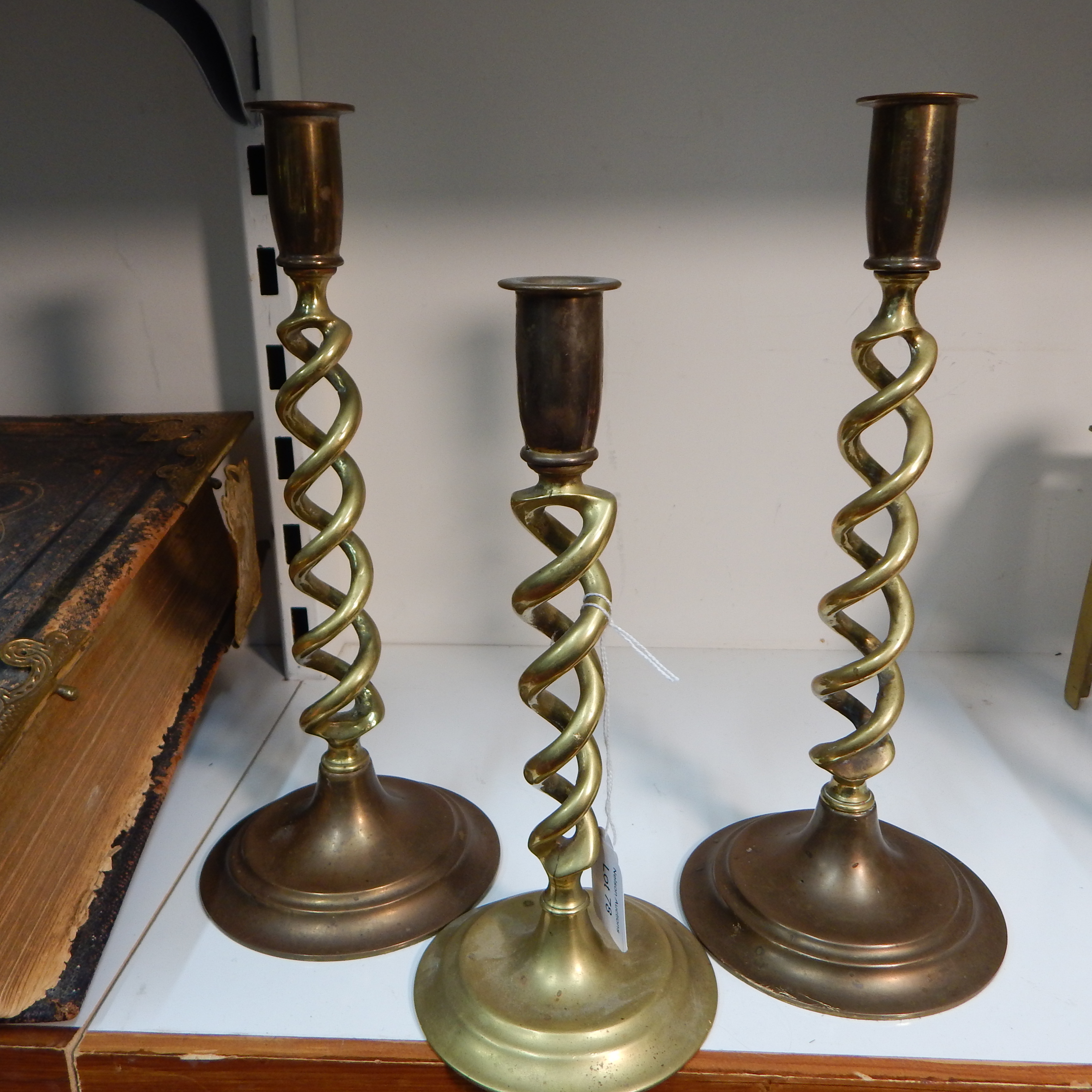 3 Brass barley twist candle sticks - 2 sizes — sold at auction in New Zealand for $25