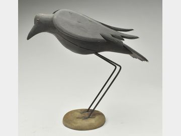 Standing crow with applied wings.