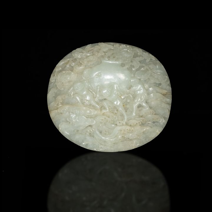 十八世紀 白玉雕運財圖瓦頭 A Chinese carved white jade plaque, 18th century